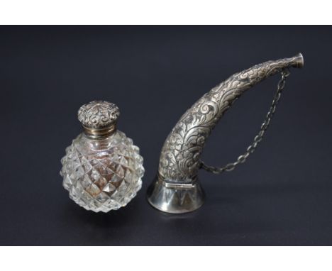 A 19th century white metal and glass horn shaped scent flask, 9cm; together with a moulded glass metal mounted vinaigrette, 5