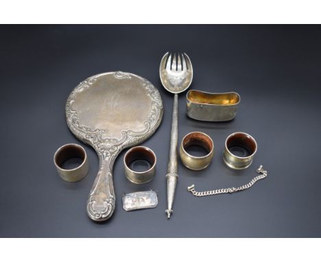 A Victorian silver salad server, by&nbsp;Chawner &amp; Co, London 1863, 30cm, 92g; together with four various silver napkin r