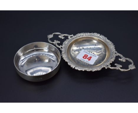A silver strainer and stand, by&nbsp;William Comyns &amp; Sons Ltd, London 1962/6, strainer 9cm diameter, 138g. 