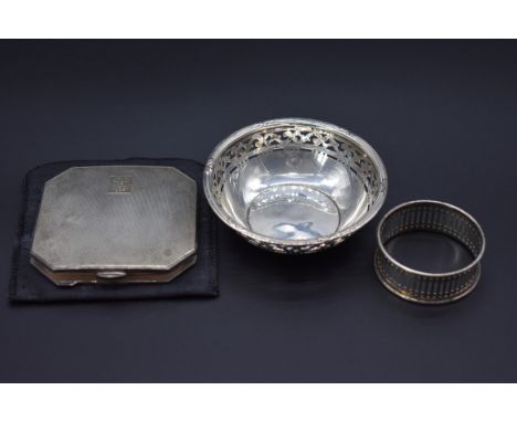 An engine turned silver compact, by&nbsp;William Neale &amp; Son Ltd, Birmingham 1947, 7cm; together with a pierced silver bo