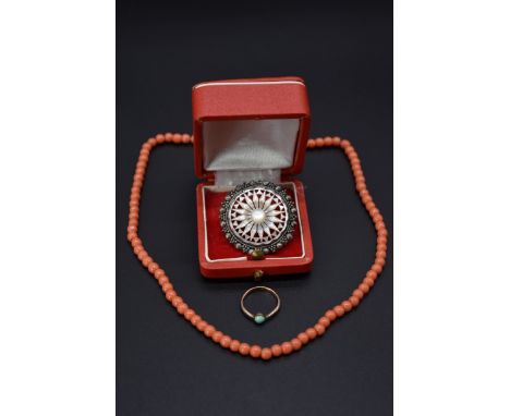 A string of coral beads; together with a turquoise ring; and a mother of pearl sterling silver brooch. (3) 