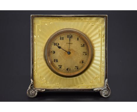 A silver and yellow guilloche enamel easel timepiece. 