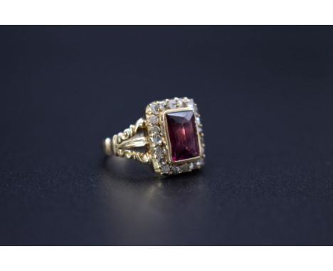 A yellow metal baguette amethyst and old cut diamond ring, size K. 