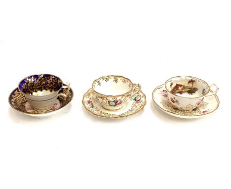 Three 19th century porcelain teacups and saucers to include one Minton cobalt blue ground with gilt leaf decoration, hand pai