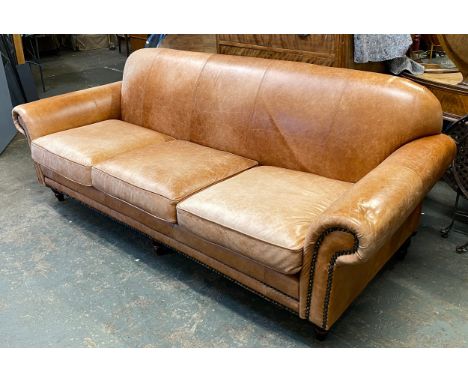 A modern three seater brown leather sofa, approx. 246cmW