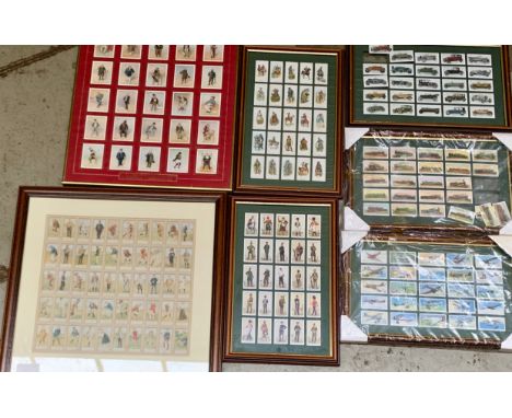 A large quantity of framed and glazed cigarette cards to include Player's Dickens, Cats, Thackeray, Terrestrial Army, Aircraf