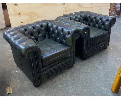 A pair of green leather button upholstered Chesterfield style armchairs, approx 105cmW