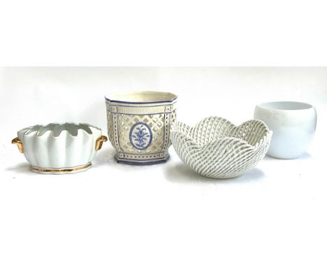 An Italian white ceramic majolica basket form bowl, 33cmD; together with a pierced blue and white planter, and two further pl