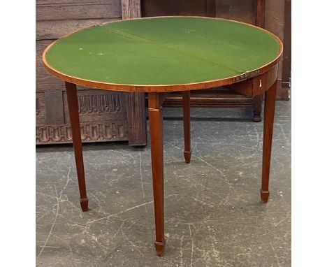 A George III demilune mahogany and boxwood strung card table on square tapered legs and spade feet, 74cmH