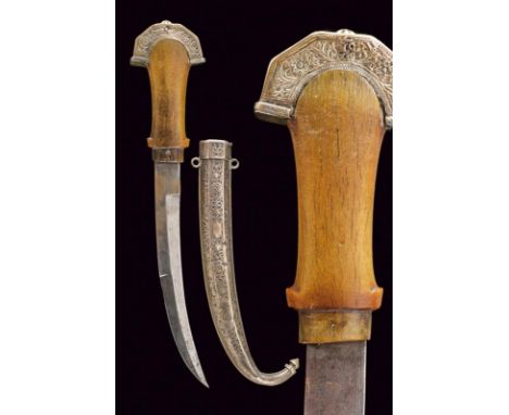 dating: 19th Century provenance: Morocco, Curved, single-and half-edged blade. Horn grip. Silver cap, engraved with floral mo