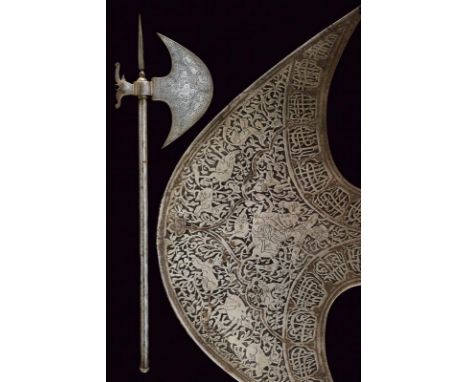 dating: 19th Century provenance: Indopersia, Convex-edged axe, engraved with effigies of various characters on a rinceaux wea