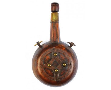 dating: 19th Century provenance: Morocco, Wooden body, embossed with geometrical bands, with a long fuse and stopper. Brass r