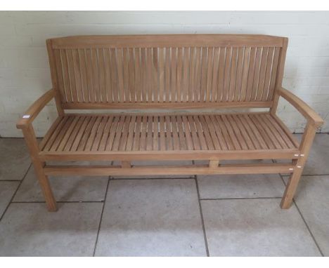 A good quality teak bench 150cm wide - boxed 
