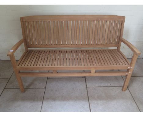 A good quality teak bench boxed 150cm wide 