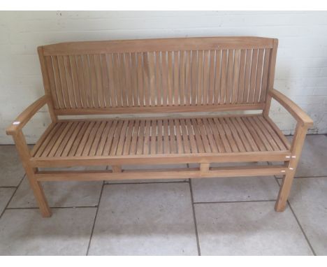 A good quality teak bench boxed 150cm wide 