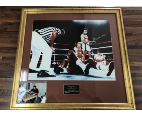 Muhammed Ali Signed Framed Boxing Photo: Depicting Ali in the rumble in the jungle fight. Nicely signed with photographic evi