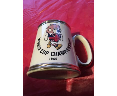 WC Willie 1966 Ceramic Football Tankard: Stunning cream mug with gold rims featuring WC Willie on one side and the World Cup 