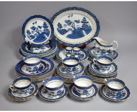 A Collection of Various Blue and White Willow Pattern Dinner Wares and Tea Wares to include Cups, Egg Cups, Saucers, Side Pla