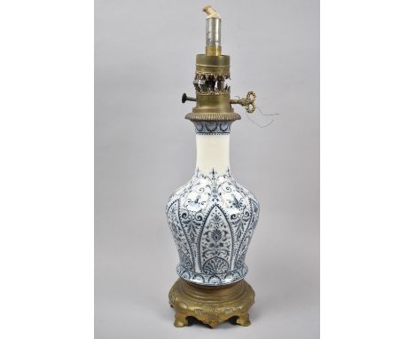 A Late 19th Century Blue and White Ceramic Vase Shaped Oil Lamp of Brass Circular Stand, 45cm High Overall 