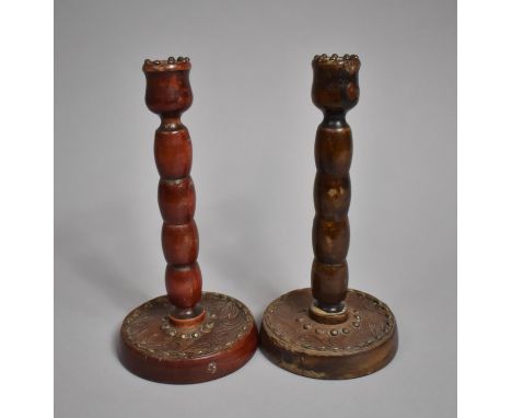 A Pair of Turned Wooden Bobbin Candlesticks on Circular Bases, 20cm high 