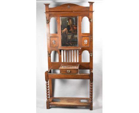 An Arts and Crafts Hall Stand with Central Glove Drawer, Display Shelf and Rectangular Mirror Over, Barley Twist Front Suppor