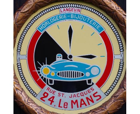 A  modern presentation of the famous 24-hour clock-face set at 4.00pm (start-time) and inscribed “Langevin Horlogerie-Bijoute