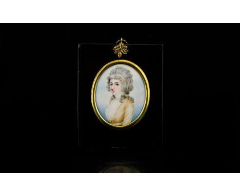 A 19th Century Portrait Miniature  Black Lacquered frame and glazed, Depicting a young lady with powdered hair and high necke