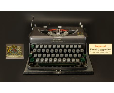 An Imperial Good Companion Standard Model Typewriter In good order with instruction book and receipt dated 1957. Please see i