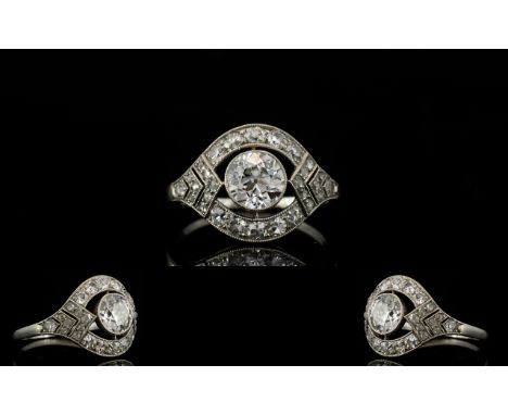 Art Deco Period - Superb Platinum Diamond Set Dress Ring of Attractive Design. The Central Round Diamond Surrounded by 28 Rou