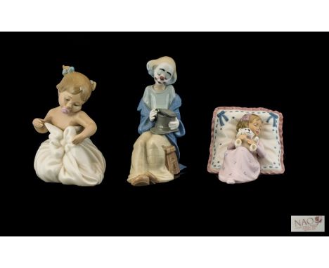 Nao by Lladro Porcelain Figures ( 2 ) + 1 Other. Comprises 1/ Young Clown Figure - Seated. Model No 1435, Height 7.25 Inches 