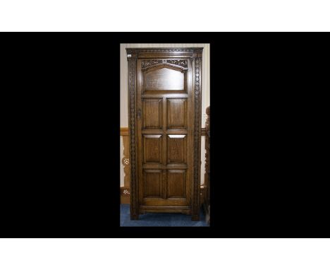 Early 20th Century Carved Oak Wardrobe 1930's single door unit with carved panelled sides, door and cornice. Raised on square