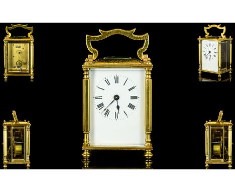 English Brass Lever Escapement Carriage Clock with glass panels.  Visible escapement.  White Porcelain dial, black numerals, 