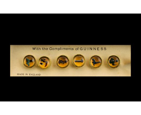 Guinness Interest A Boxed Set Of Six Enamel Studs Circa 1950's, each of circular form with enamel centres depicting various i