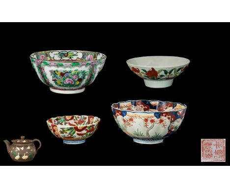 A Small Collection Of Oriental Ceramics To include two Imari bowls with fluted edge, a famille rose bowl, and a Yixing teapot