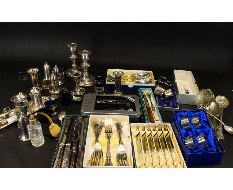 A Mixed Collection Of Silver Plated Items To include flatware, condiments with inner blue glass liners, napkin rings, serving