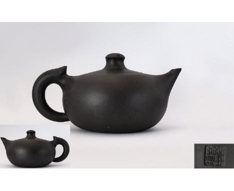 Chinese Republic Yixing Teapot  Of plain form with squat body and character marks for GeTaoZhong. Height, 2 inches, length 6 