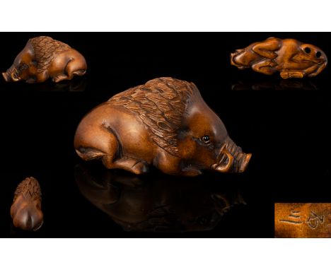 Japanese - Good Quality and Signed Late 19th Century Boxwood Netsuke, The Carving Depicts a Warthog In a Crouching Position. 