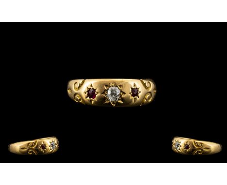 Victorian Period Attractive 18ct Gold Diamond and Ruby Dress Ring - the central diamond flanked by two rubies of pleasing col