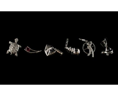 A Collection Of Six 9ct White Gold Diamond And Ruby Set Charms Each hallmarked to bale, to include ruby set wishbone charm, d