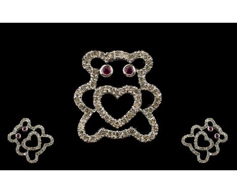 9ct White Gold Diamond And Ruby Set Pendant In The Form Of A Teddybear Fully hallmarked, the eyes set with small faceted rubi