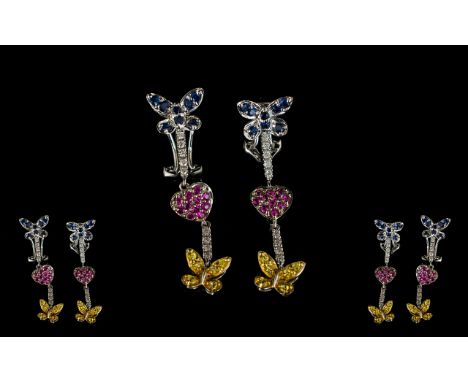 Pair Of 9ct Diamond Sapphire And Ruby Earrings Drop earrings with a ruby heart set between blue and yellow sapphire set butte