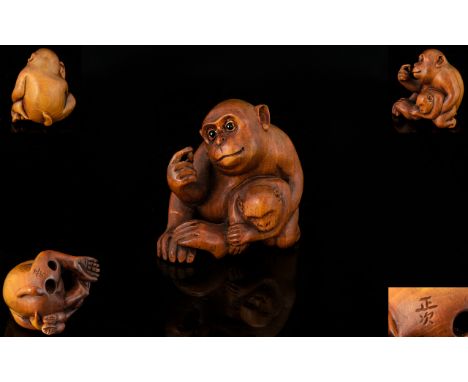 Japanese - Nice Quality and Signed Late 19th Century Boxwood Netsuke, The Carving Depicts a Mother and Baby Monkey In a Seate