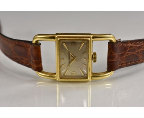 Jaeger Le Coultre - an unusual lady's 18ct gold wristwatch, rectangular silvered dial, arrow batons, Arabic numerals at 3 and