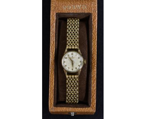Omega - a 9ct gold lady's wristwatch, textured gilt dial, raised Arabic numerals, minute track, arrow hands, manual wind 244 