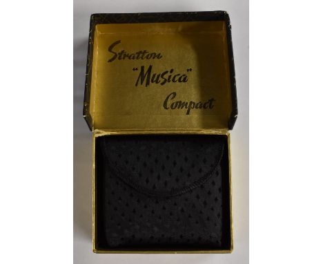A Stratton Musica compact, faux mother of pearl lid featuring treble clef and musical notes set with paste stones, curled fea