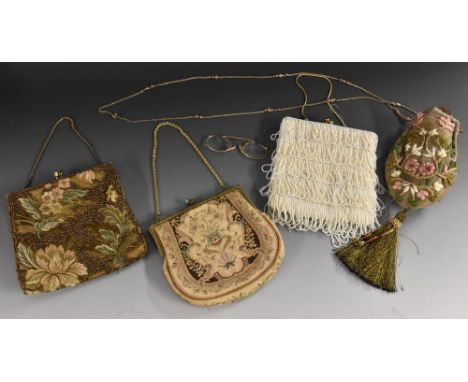 An embroidered purse, long chain strap, metallic thread tassel; a beaded evening purse; another similar; a tapestry purse; a 