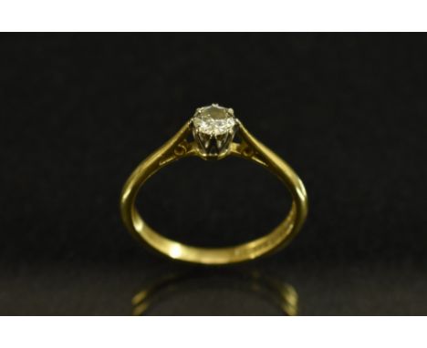 A diamond solitaire ring, round brilliant cut, approx 0.24ct, white metal eight point crown claw, 18ct gold Lifetime shank, B