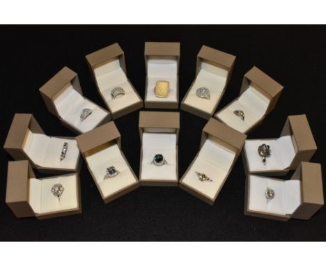 Rings - a cubic zirconia floral cluster ring;  another larger;  others round clusters, rectangular, linear, solitaire,  rose 