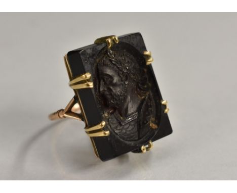 A 19th century neoclassical intaglio ring, rectangular panel carved with a Roman Emperor, later 9ct gold shank, stamped 9ct, 
