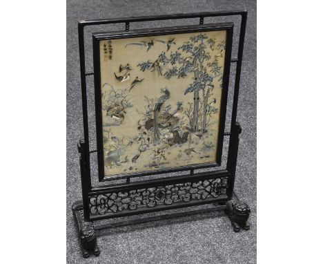 A Victorian Chinoiserie fire screen with silk panel embroidered with fanciful birds